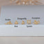 Gold labret flat back stud earrings in unique shapes, including bee, snake, scorpion, dragonfly, and spider designs — perfect for curated ear styling. Stainless steel metal.