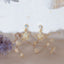 Gold star drop earrings with sparkly cubic zirconia, dainty celestial jewelry perfect for stargazer gifts, teen fashion, or zodiac style lovers.