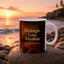 Midnight Love Rhythms romantic mug on a rock by the ocean at sunset