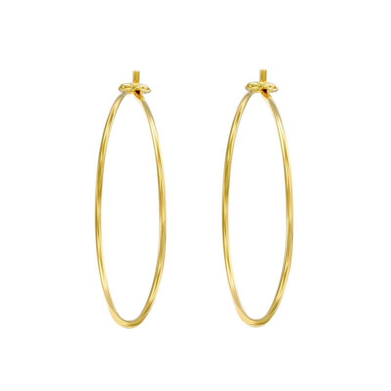 Gold-plated 14K hoop earrings with a diameter of 3 inches. The earrings are designed in a classic circular shape and feature a shiny, reflective surface. They are worn through pierced ears and are suitable for various occasions